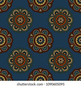 Abstract seamless backdrop. Round colorful texture in green, red and blue colors. Mandala background. Oriental pattern for design