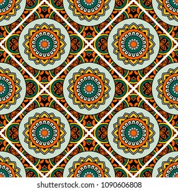 Abstract seamless backdrop. Round colorful texture in green, yellow and orange colors. Mandala background. Oriental pattern for design