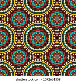 Abstract seamless backdrop. Round colorful texture in red, yellow and blue colors. Mandala background. Oriental pattern for design