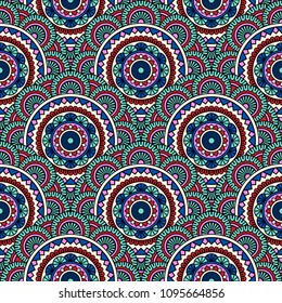 Abstract seamless backdrop. Round colorful texture in blue and red colors. Mandala background. Oriental pattern for design