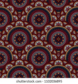 Abstract seamless backdrop. Round colorful texture in red, gray and blue colors. Mandala background. Oriental pattern for design