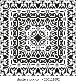 Abstract seamless background with black symbolical floral patterns on white. Vector
