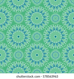 Abstract seamless background. Blue and green repeating kaleidoscope mosaic pattern. Vector