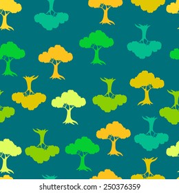 Abstract seamless background with colorful stylized trees, vector illustration. Eco motifs. Decorative pattern for wallpaper, fabric, textile, poster, banner, clothing, home decor, web.