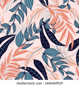 Abstract seamless background with colorful tropical leaves and bright plants on beige background. Vector design. Jungle print. Floral background. Printing and textiles. Exotic tropics. Fresh design.