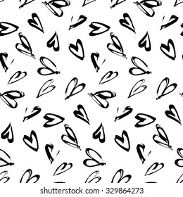 Abstract seamless background pattern with hearts hand painted . Craft paper .