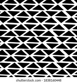 Abstract seamless black and white pattern of hand drawn doodle triangle elements. Scandinavian design style. Vector illustration for textile, backgrounds etc