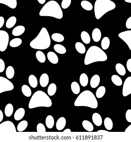 Abstract seamless black and white paws pattern.