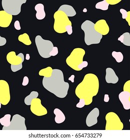 Abstract seamless chaotic pattern with military style. Modern wallpaper in trendy pastel colors. Yellow, gray and pink. Black background texture with spots and blots. Repeat endless design. Vector.