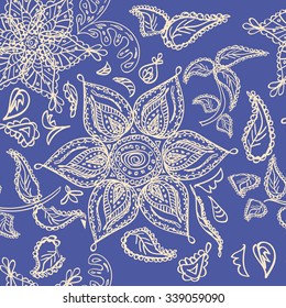 Abstract seamless floral pattern of beige colored hand drawn by pencil outline fantasy leaves, flowers and curly branches on a dark blue background. Floral ornate print