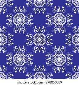 Abstract seamless floral pattern on a dark blue background.