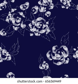 Abstract seamless floral pattern with stylized image of rose flowers, imitation embroidery on fabric. Monochrome colors. Vector illustration. Blue indigo background.