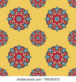 Abstract seamless flower backdrop. Design for prints, textile, decor, fabric. Round colorful texture in yellow, blue and red colors. Mandala background