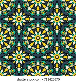 Abstract seamless flower backdrop. Design for prints, textile, decor, fabric. Round colorful texture in blue and yellow colors. Mandala background