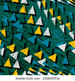 Abstract seamless geometric background with chaotic triangles. Grunge, texture pattern. Wallpaper for boys and girls. Urban colorful backdrop.