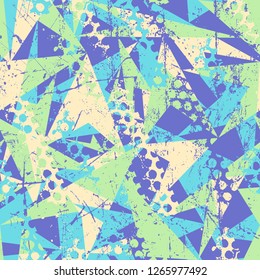 Abstract seamless geometric background with triangles cracked texture, dots, drops and splashes. Grunge pattern for boys, girls, sport, fashion. Urban colorful wallpaper.