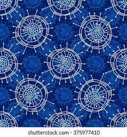Abstract seamless geometric pattern in doodle style. White snowflakes on blue background, hand drawn, vector. For background design and decoration, wallpaper, packaging, fabrics, textiles.