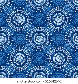 Abstract seamless geometric pattern in doodle style. White snowflakes on blue background, hand drawn. For background design and decoration, wallpaper, packaging, fabrics, textiles.