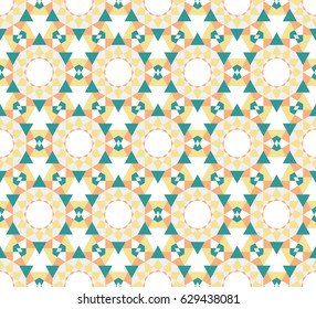 Abstract seamless geometric pattern of many elements. A kaleidoscope of shapes and shades of colors.