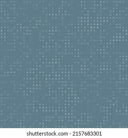 Abstract seamless geometric pattern. Mosaic background of white triangles. Evenly spaced small shapes of different color. Vector illustration on blue gray background