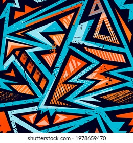 Abstract seamless Grunge geometric pattern with blue and orange arrows, triangles, squares, curved lines. Shabby textured geometrical repeat print for sport textile, clothes, wrapping paper.