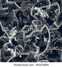Abstract seamless grunge pattern for boy. Urban style on dark chaos background with colorful spray paint, ink, speed squares, triangles and geometric shape elements.Modern creative wallpaper for guys.