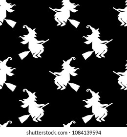 Abstract seamless halloween pattern for girls or boys. Creative vector background with cat, whitch, halloween. Funny pattern for textile and fabric. Fashion halloween style. Colorful bright picture