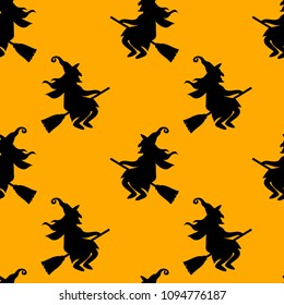 Abstract seamless halloween pattern for girls or boys. Creative vector background with cat, whitch, halloween. Funny pattern for textile and fabric. Fashion halloween style. Colorful bright picture