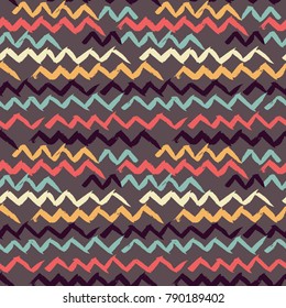 Abstract seamless hand drawn pattern. Modern grunge texture. Colorful pen-brush painted background. Texture with zigzag strokes.