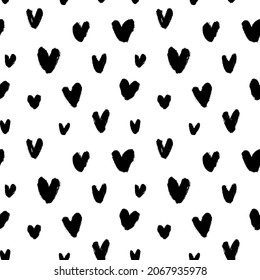 Abstract seamless heart pattern in polka dot style. Hand drawn simple black tiny hearts. Love and romantic theme background. Vector modern grunge ornament for Valentines day and wedding. 