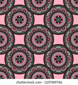 Abstract seamless mandala background. Texture in green and pink colors. Oriental pattern for design, fashion print, scrapbooking