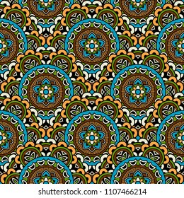 Abstract seamless mandala background. Texture in blue and yellow colors. Oriental pattern for design, fashion print, scrapbooking