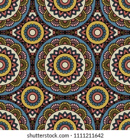 Abstract seamless mandala background. Texture in blue, yellow and rose colors. Oriental pattern for design, fashion print, scrapbooking