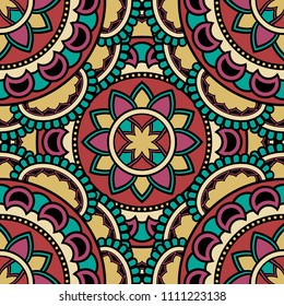 Abstract seamless mandala background. Texture in yellow, red and turquoise colors. Oriental pattern for design, fashion print, scrapbooking