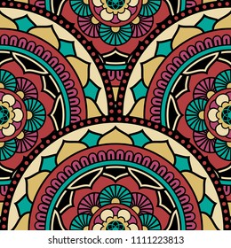 Abstract seamless mandala background. Texture in red and turquoise colors. Oriental pattern for design, fashion print, scrapbooking