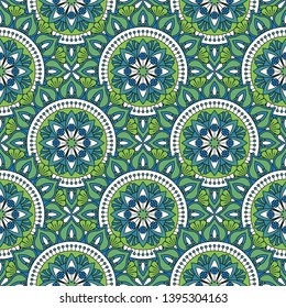 Abstract seamless mandala background. Texture in green and blue  colors. Oriental pattern for design, fashion print, scrapbooking