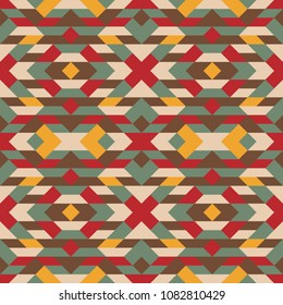 Abstract seamless multicolor pattern. Vector geometric background  in green, red, brown and yellow colors. Mosaic texture for textile, clown, carpeting, warp, book cover, clothes