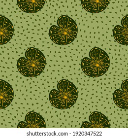 Abstract seamless nature pattern with doodle green simple style water lily silhouettes. Light green dotted background. Designed for fabric design, textile print, wrapping, cover. Vector illustration