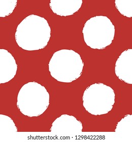 Abstract seamless paper with hand drawn circles on red background. Hand ink painted circles. Ink grunge texture. Design element for fabric, textile, wrapping paper. Scandinavian style.