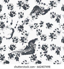 Abstract seamless pattern - black ink prints with messy dog / cat paws and human feet tracks. Creative monochrome backdrop with irregular animal footprints