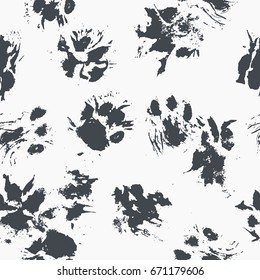Abstract seamless pattern - black ink prints with messy dog / cat paws. Creative monochrome backdrop with irregular animal footprints