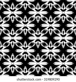 Abstract seamless pattern in black and white. Hand drawn monochrome ornamental wallpaper or textile pattern in vector format.