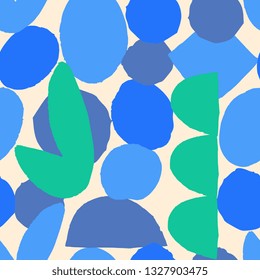 Abstract seamless pattern in blue and green on cream background.