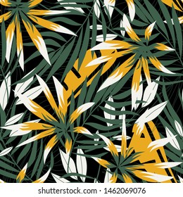 Abstract seamless pattern with bright tropical leaves and plants on black background. Vector design. Jungle print. Floral background. Printing and textiles. Exotic tropics. Summer design.