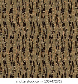 Abstract seamless pattern with camouflaged marbled shapes in yellow, black, orange and olive tones.