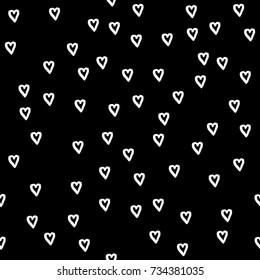 Abstract seamless pattern. Casual  dot wallpaper design element.Black background with white heart hand drawn texture with heart. Valentines day seamless