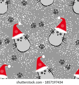 Resumen de un patrón impecable con gatos en sombreros de Navidad con fondo gris.