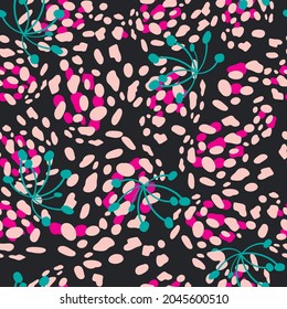 Abstract seamless pattern with chaotic dots and floral elements.