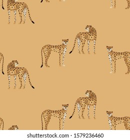 Abstract  seamless pattern with cheetahs on sand background. Vector illustration