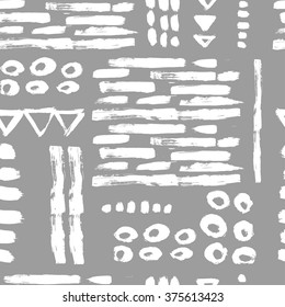 Abstract seamless pattern with circles, triangles and brush strokes. Hand drawn background.
